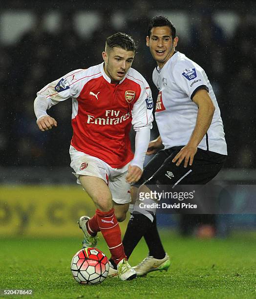 Dan Crowley of Arsenal takes on Tom Koblenz of Derby during the Barclays U21 Premier League match between Derby County U21 and Arsenal U21 at iPro...