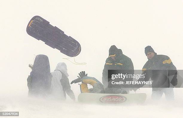 Strong wind gusts of over 40mph made it hard for Aurora, Illinois, residents to hold onto their sleds 22 January after 10 inches of snow fell in the...