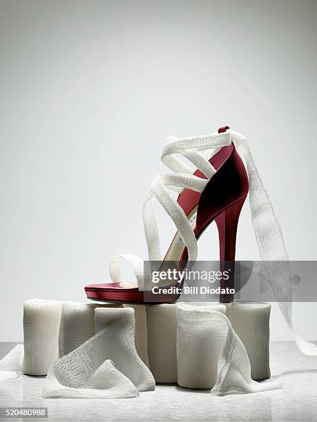 high heel on gauze rolls - mullbinde stock-fotos und bilder