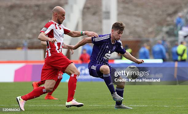 Daniel Brueckner of Erfurt challenges Marcel Kandziora of Osnabrueck during the Third League match between FC Rot Weiss Erfurt and VFL Osnabrueck at...