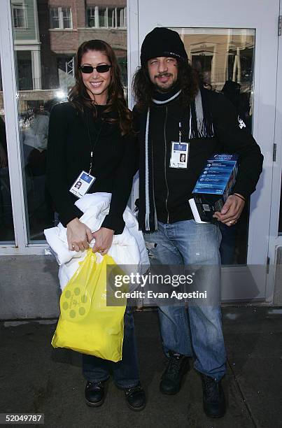 Actress Shannon Elizabeth and husband Joseph D. Reitman walk on Main Street during the 2005 Sundance Film Festival on January 22, 2005 in Park City,...