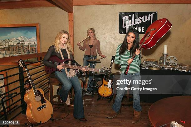 Elisabeth Harnois, Jane Krakowski and Adi Schnall visit the Gibson display at the Gibson Gift Lounge during the 2005 Sundance Film Festival on...