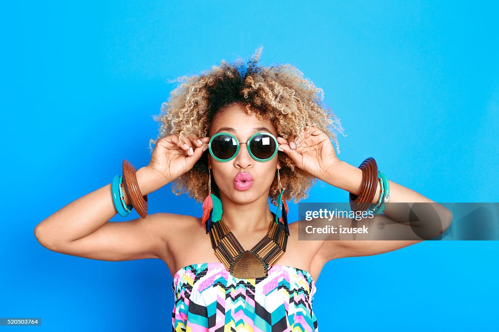Summer portrait of surprised afro american young woman