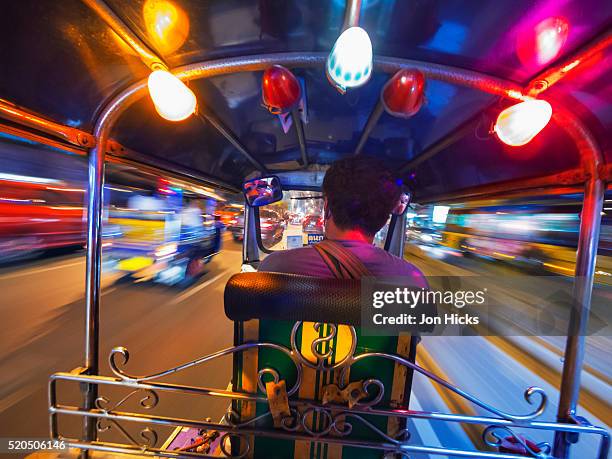 riding in a bangkok tuk tuk. - jinrikisha stock-fotos und bilder