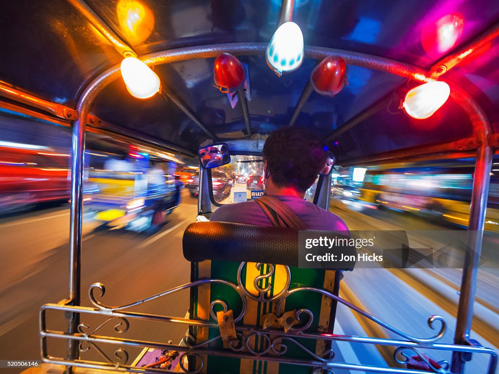 Riding in a Bangkok tuk tuk.