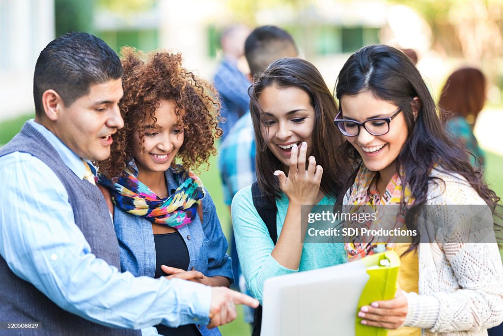 Professor talking to diverse group of high school girls