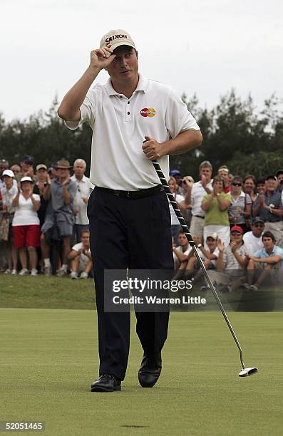 Tim Clark of South Africa celebrates winning the South African Airways Open on the 18th green at Durban Country Club on January 23, 2005 in Durban,...