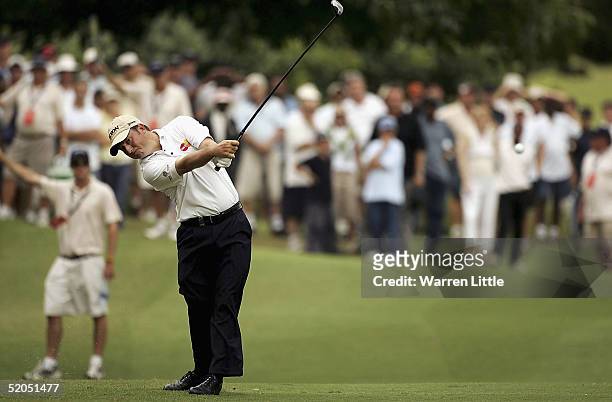 Tim Clark of South Africa plays his second shot into the eighth green during the final round of South African Airways Open on the 18th green at...