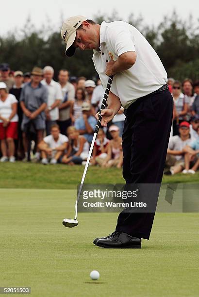 Tim Clark of South Africa sinks a putt to win the South African Airways Open at Durban Country Club on January 23, 2005 in Durban, South Africa.