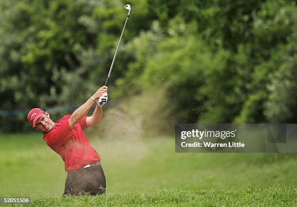 Charl Schwartzel of South Africa plays out of the fairway bunker on the eighth hole during the final round of South African Airways Open at Durban...