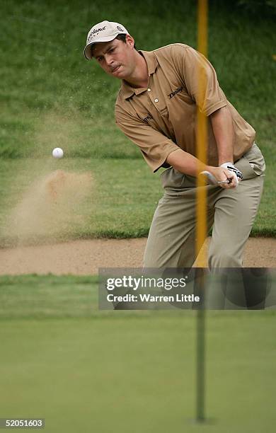 David Howell of England plays out of a greenside bunker on the 11th hole during the final round of South African Airways Open at Durban Country Club...