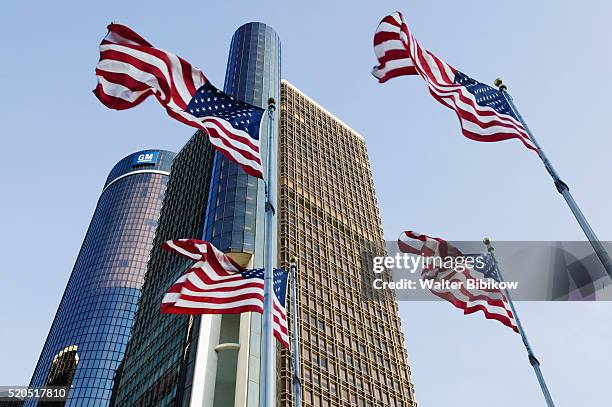 flags flying near renaissance center - renaissance center stock pictures, royalty-free photos & images