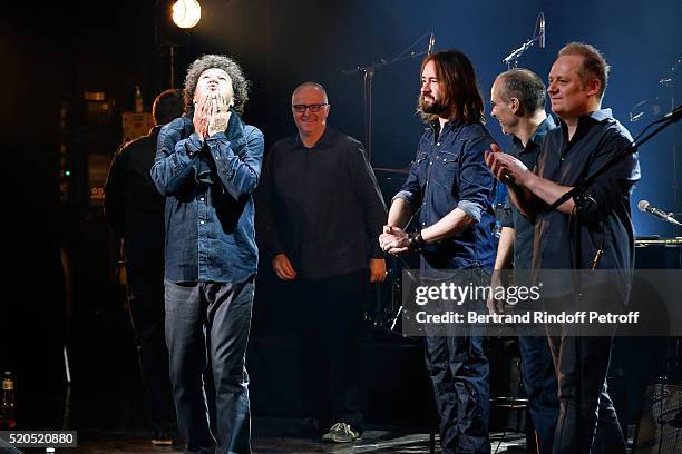 Singer Robert Charlebois and his musicians acknowledge the applause of the audience at the end of his "50 ans, 50 chansons" : Concert at Bobino on...