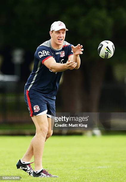 Dylan Napa passes during a Sydney Roosters NRL training session at Moore Park on April 12, 2016 in Sydney, Australia.