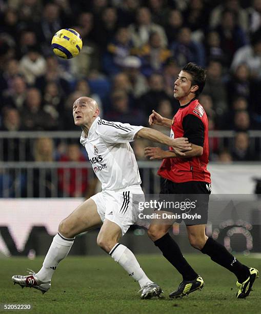 Thomas Gravesen of Real Madrid fends off Luis Garcia of Mallorca during the Primera Liga match between Real Madrid v Mallorca at the Bernabeu Stadium...