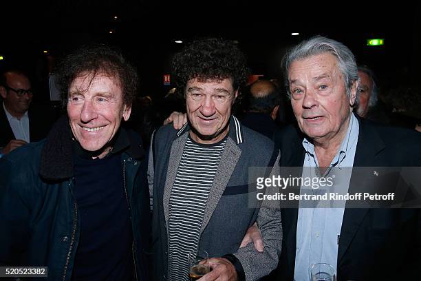 Singers Alain Souchon, Robert Charlebois and actor Alain Delon pose after the Robert Charlebois : "50 ans, 50 chansons" : Concert at Bobino on April...