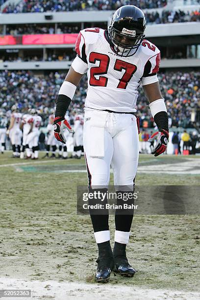 Safety Cory Hall of the Atlanta Falcons checks for any markings on the field after tightend Chad Lewis of the Philadelphia Eagles caught a 2-yard...