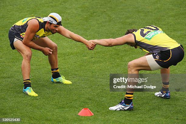 Sam Lloyd of the Tigers and Ivan Maric of the Tigers during a Richmond Tigers AFL media session at ME Bank Centre on April 12, 2016 in Melbourne,...