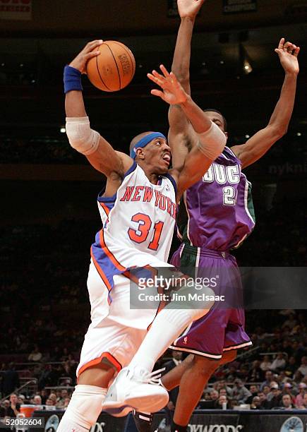 Jerome Williams of the New York Knicks drives to the basket against Desmond Mason of the Milwaukee Bucks on January 23, 2005 at Madison Square Garden...