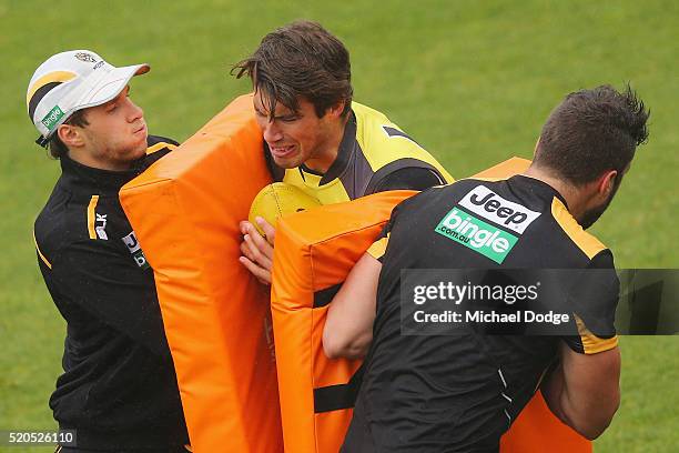 Alex Rance of the Tigers is hit by contest bags during a Richmond Tigers AFL media session at ME Bank Centre on April 12, 2016 in Melbourne,...