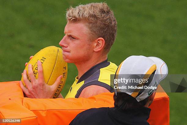 Taylor Hunt of the Tigers is hit by contest bags during a Richmond Tigers AFL media session at ME Bank Centre on April 12, 2016 in Melbourne,...