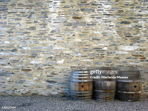 wine barrels against wall - marianna wall stock pictures, royalty-free photos & images