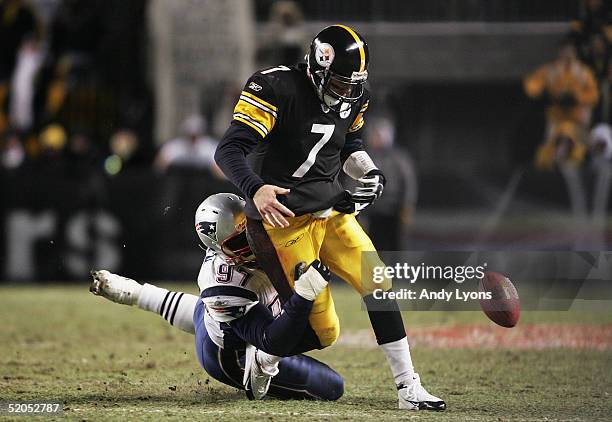 Defensive lineman Jarvis Green of the New England Patriots hits and causes quarterback Ben Roethlisberger of the Pittsburgh Steelers to fumble in the...