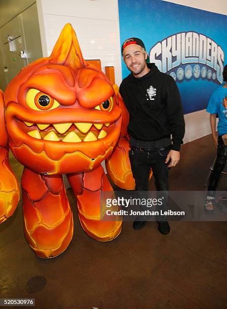 Pete Wentz and Skylanders Eruptor celebrate the fifth year of the wildly popular videogame franchise, Skylanders, at Duff's Cakemix on April 11, 2016...