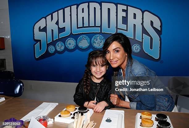 Gia Lopez and Courtney Lopez help Skylanders celebrate the fifth year of the wildly popular videogame franchise at Duff's Cakemix on April 11, 2016...