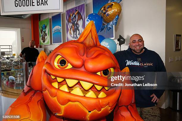 Chef Duff Goldnman and Skylanders Eruptor celebrate the fifth year of the wildly popular videogame franchise, Skylanders, at Duff's Cakemix on April...