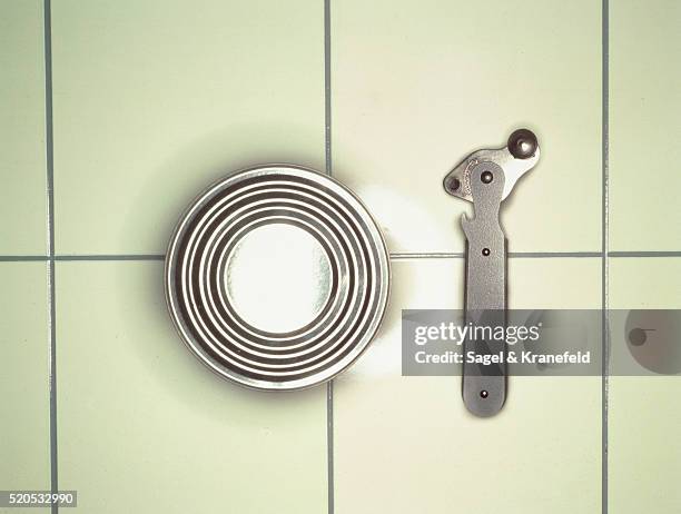 can-opener and can. elevated view - can opener stock pictures, royalty-free photos & images