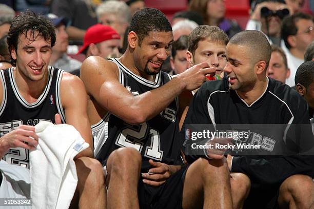 Manu Ginobili, Tim Duncan and Tony Parker of the San Antonio Spurs enjoy a victory over the Sacramento Kings on January 23, 2005 at Arco Arena in...