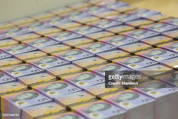 In the handout image provided by the Reserve Bank of Australia, stacks of new $5 banknote is on display. The Reserve Bank of Australia today released...