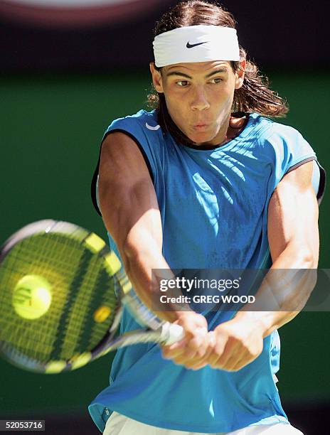 Rafael Nadal of Spain hits a return against third seed Lleyton Hewitt of Australia in their men's singles fourth round match at the 2005 Australian...