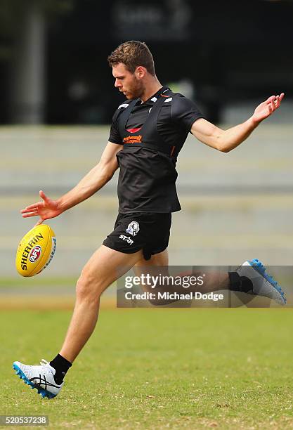 Matt Scharenberg of the Magpies kicks the ball during a Collingwood Magpies AFL training session on April 12, 2016 in Melbourne, Australia.