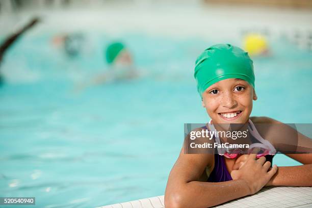 taking swimming lessons - swimming cap stock pictures, royalty-free photos & images