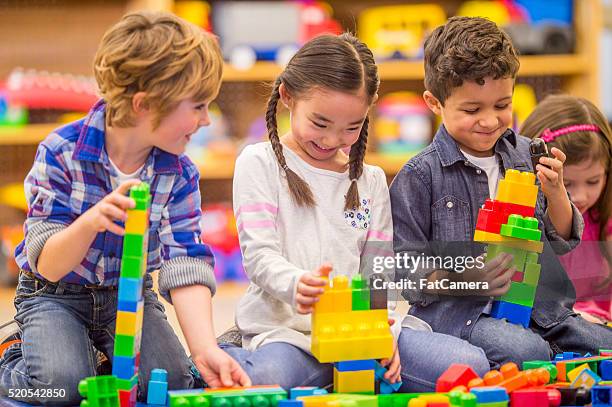 building blocks together in class - child and blocks stock pictures, royalty-free photos & images