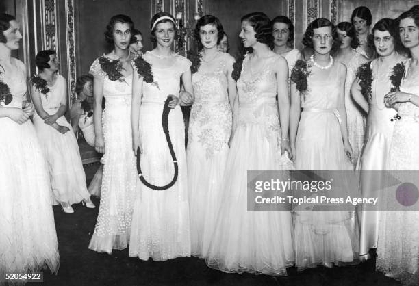 Guests at Queen Charlotte's birthday ball at the Dorchester Hotel, London, May 1931.