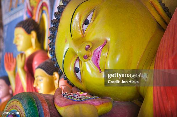 the reclining buddha at the asgiriya monastery - kandy sri lanka stock pictures, royalty-free photos & images