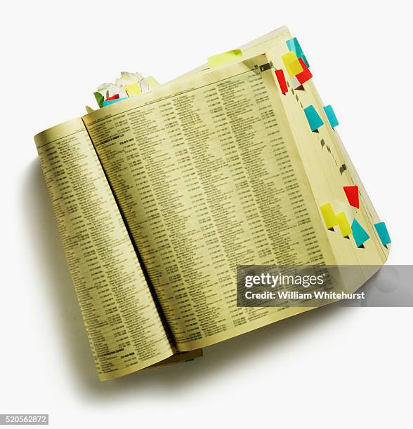 yellow pages marked with tabs - telefonbuch stock-fotos und bilder