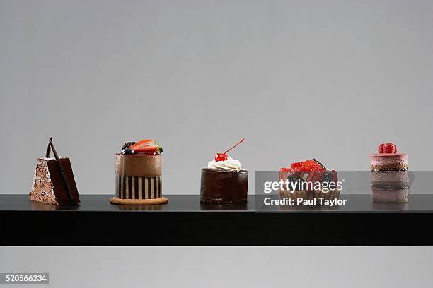 table set with tempting desserts - dessert sweet food stock-fotos und bilder