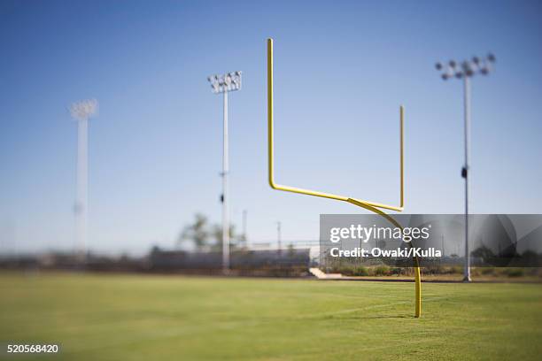 goalpost on empty football field - goal post stock pictures, royalty-free photos & images