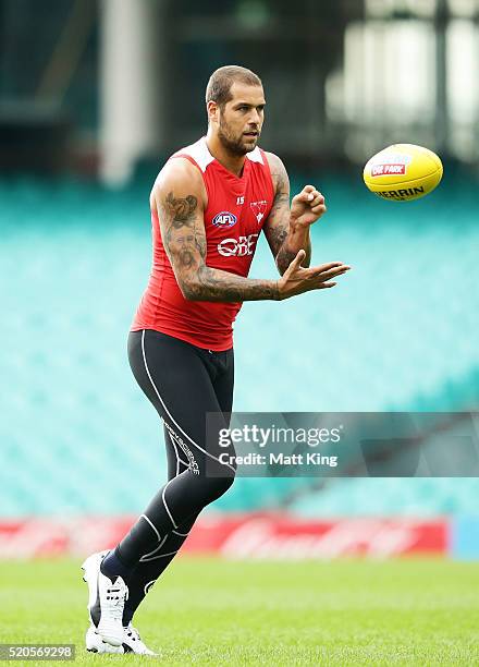 Lance Franklin of the Swans handles the ball during a Sydney Swans AFL training session at Sydney Cricket Ground on April 12, 2016 in Sydney,...