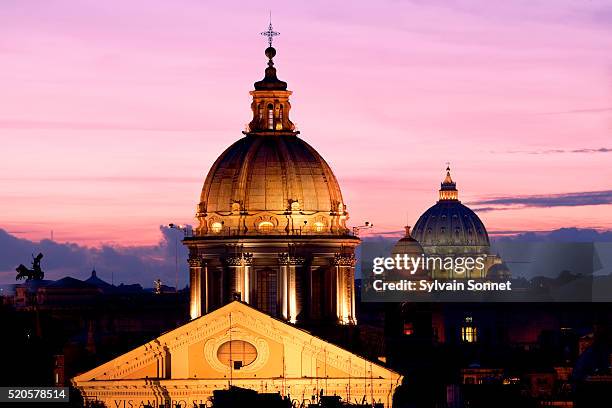 st. peter's basilica at twilight - petersdom stock-fotos und bilder