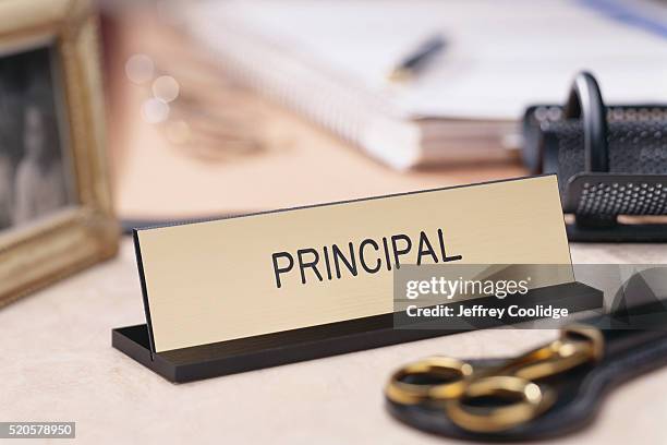 school principal nameplate on a desk - nameplate fotografías e imágenes de stock