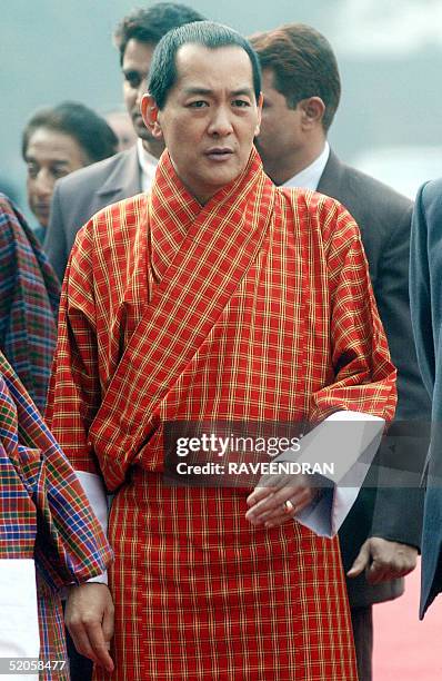 Bhutan's King Jigme Singye Wangchuck arrives to a welcome ceremony at the Presidential Palace in New Delhi, 25 January 2005. Wangchuck has started a...