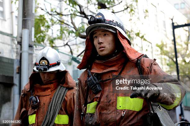Firefighters are seen in the Golden Gai district of Kabukicho on April 12, 2016 in Tokyo, Japan. According to the Tokyo Fire Department, the fire had...