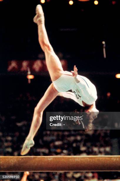 Romanian champion Nadia Comaneci, aged 14, performs during the women's beam of the artistic gymnastics event of the Montreal Olympic Games on July...