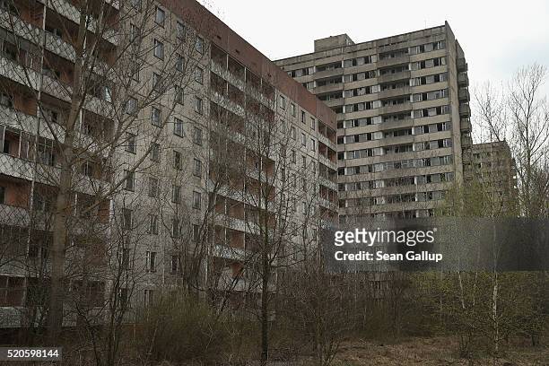 Former apartment buildings stand abandoned on April 9, 2016 in Pripyat, Ukraine. Pripyat, built in the 1970s as a model Soviet city to house the...