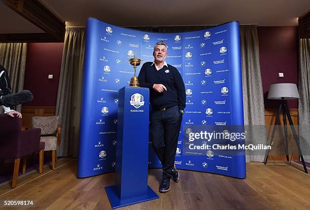 European Ryder Cup captain Darren Clarke poses with the trophy at Royal Portrush golf club as part of the Ryder Cup Trophy Tour launch on April 12,...